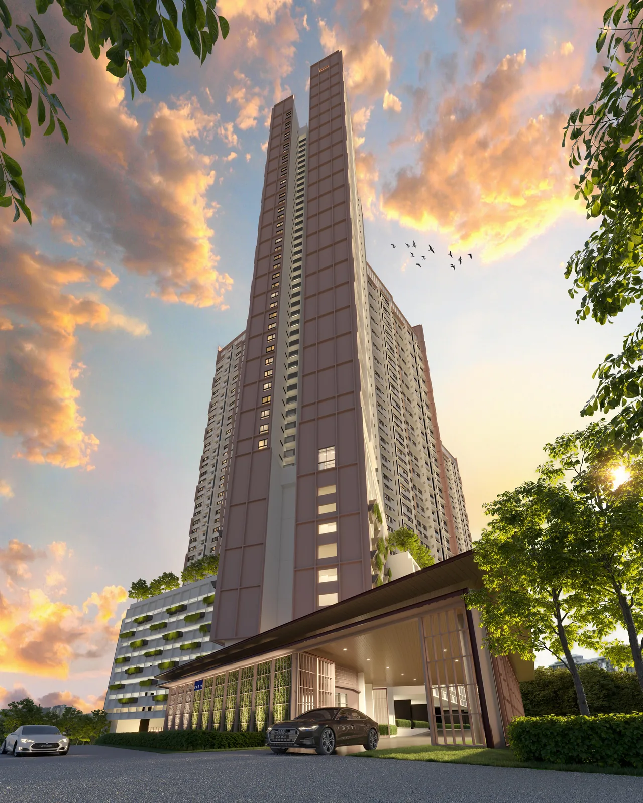 The Queenswoodz towers at dusk, seen from the drop-off in Bukit Jalil
